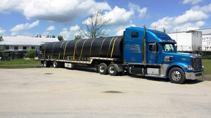 Removable Gooseneck (RGN) trailers are built for oversized and overweight freight requiring ground‑level loading and specialized handling.